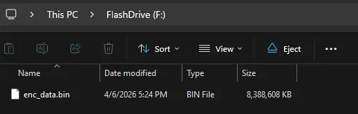 Windows File Explorer showing the NTFS flash drive with the enc_data.bin encrypted file container visible