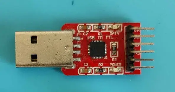 Close-up photograph of the CP2102-based USB to UART adapter used for testing