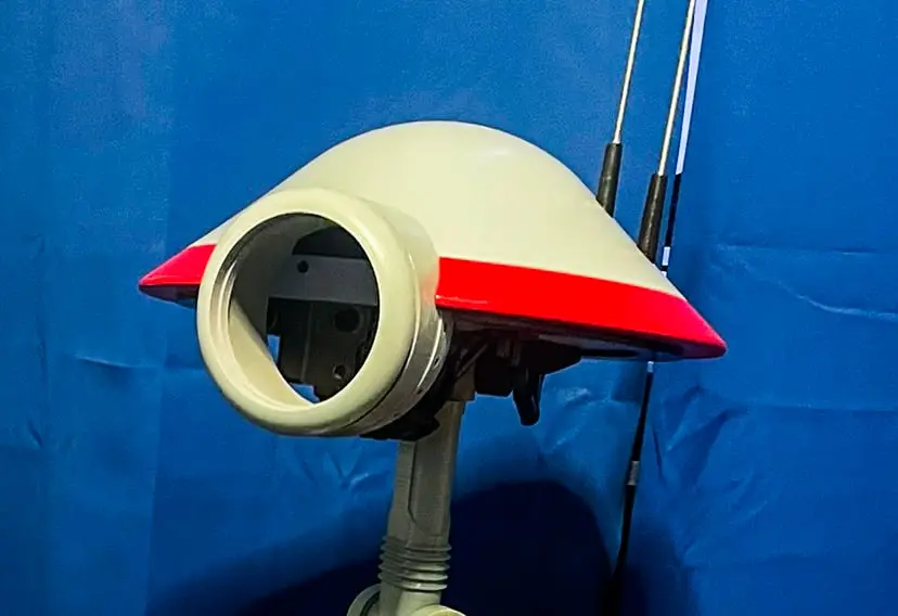 The circular eye opening of the Pit Droid before the camera mount